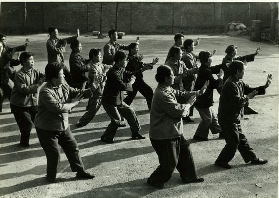 Workers at a textile factory in Tianjin doing shadow boxing (Taiji quan).jpg